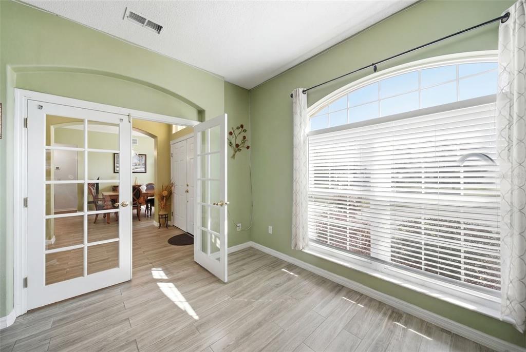2614 Grapevine Crest Ocoee, FL 34761 - Photo 10 of 24 a view of a room with wooden floor and windows
