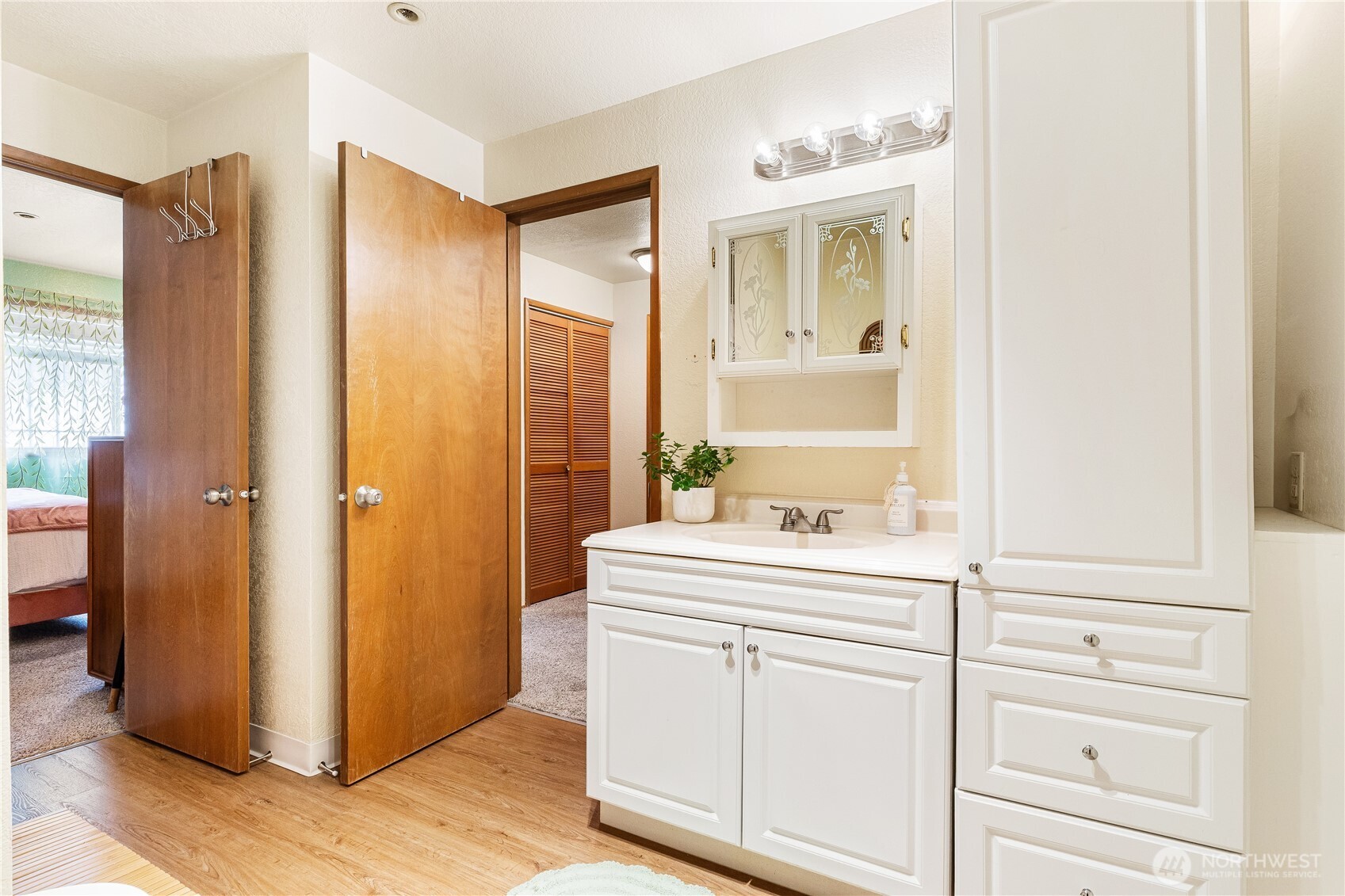 2619 Rucker Avenue, Unit 2 Everett, WA 98201 - Photo 22 of 33 a bathroom with a sink a mirror and a vanity