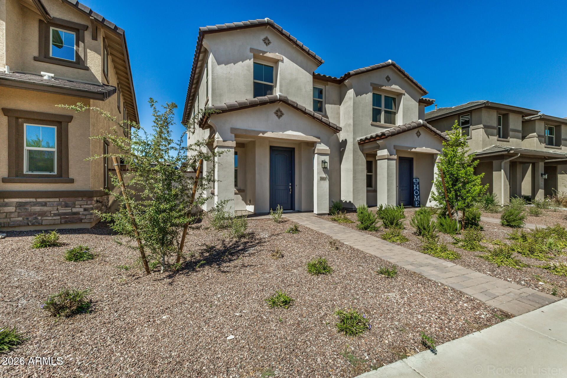 20618 West Thomas Road Buckeye, AZ 85396 - Photo 35 of 38 a front view of a house with garden