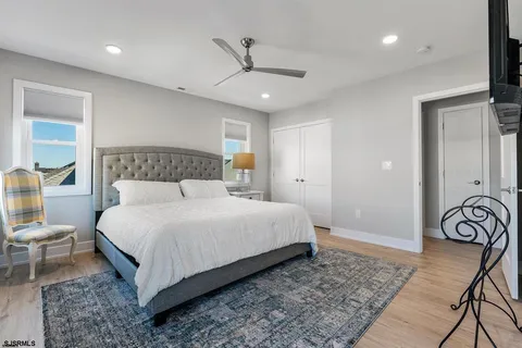 a bedroom with a bed and a table