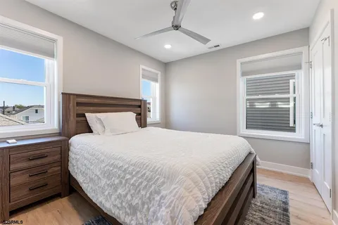 a bedroom with a large bed and a window