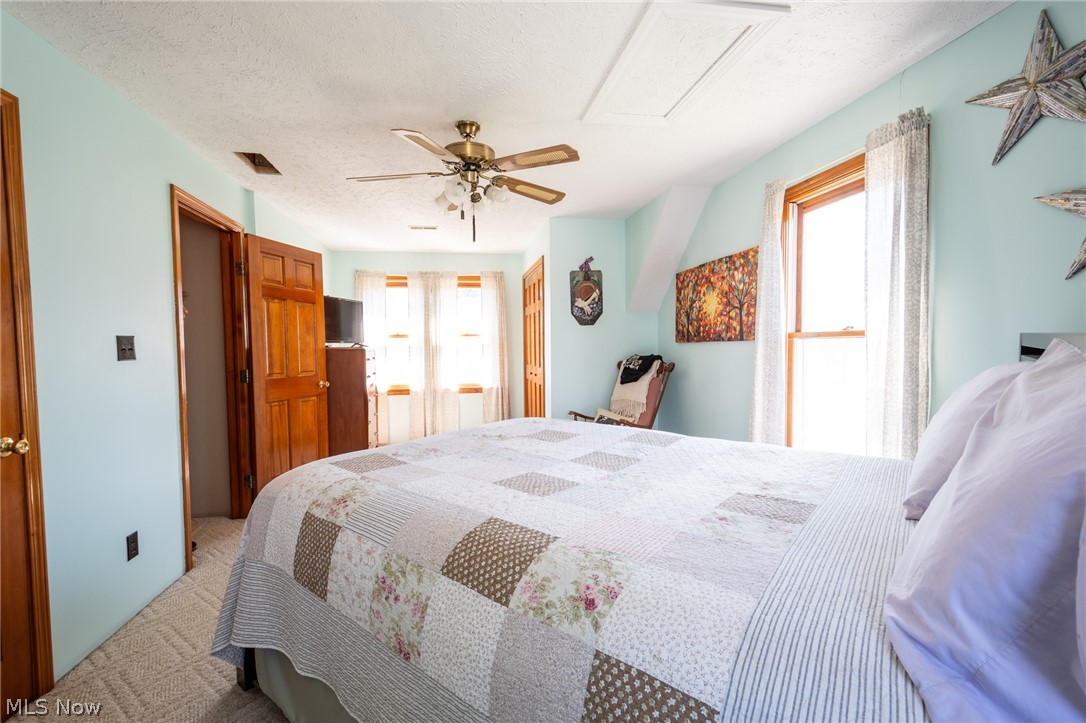 14027 Mayfield Road Huntsburg, OH 44046 - Photo 22 of 50 Bright interior room with light blue walls and textured carpet