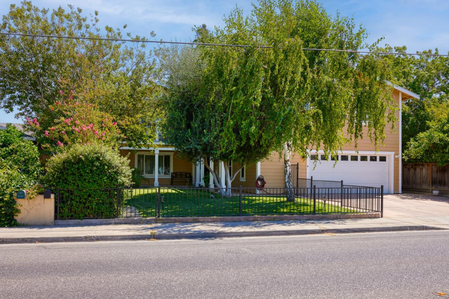 front view of a house with a garden
