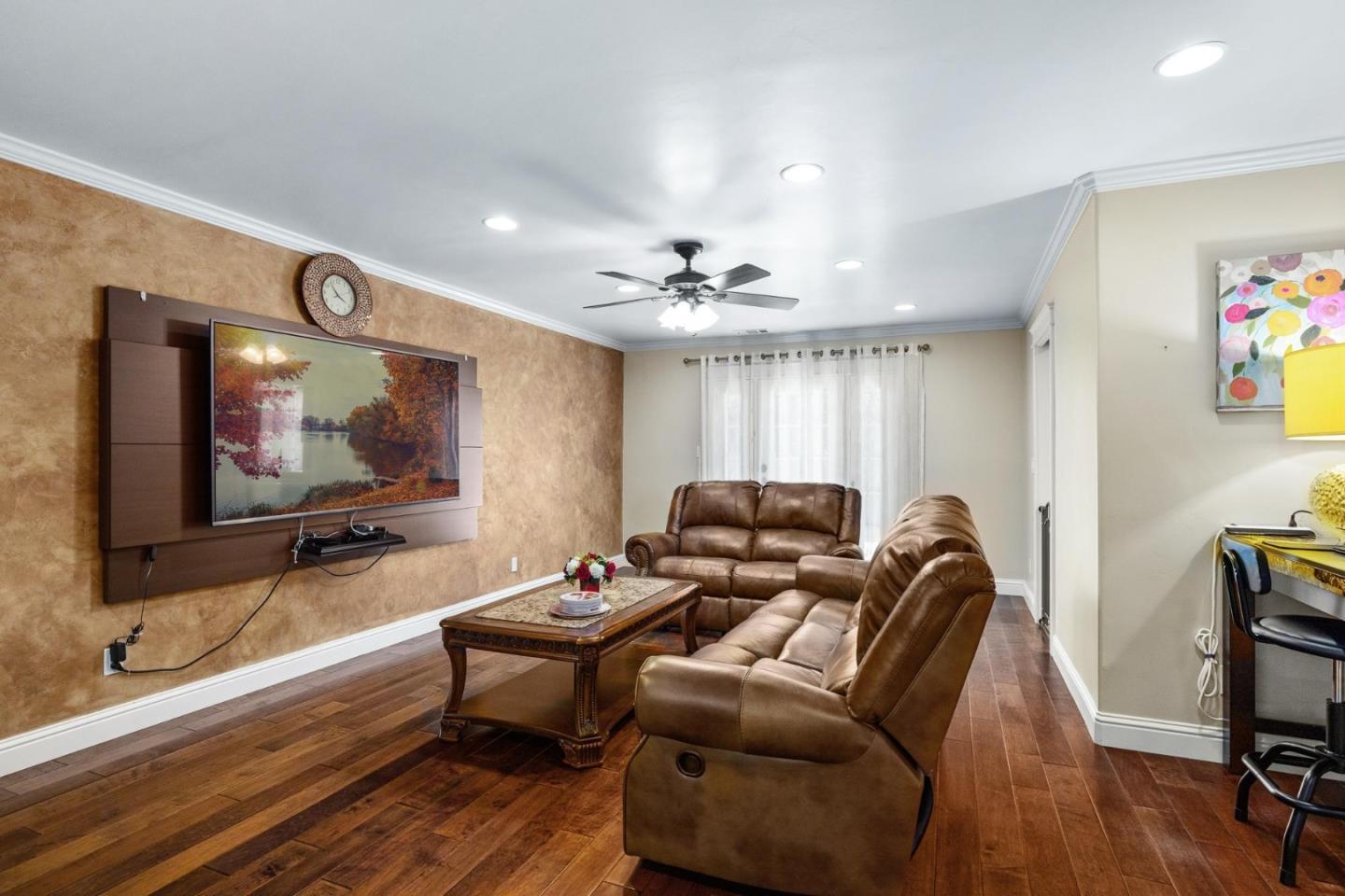 1504 Mable Avenue Modesto, CA 95355 - Photo 12 of 47 a living room with furniture and a flat screen tv