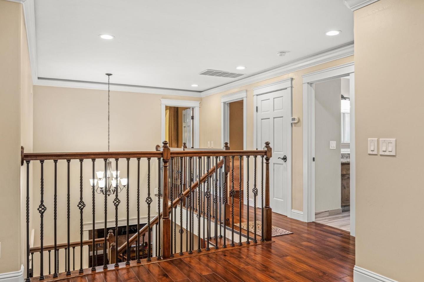 1504 Mable Avenue Modesto, CA 95355 - Photo 19 of 47 a view of a hallway with wooden floor and windows