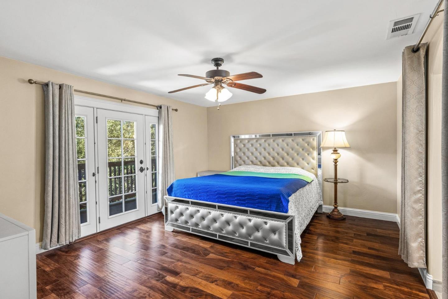 1504 Mable Avenue Modesto, CA 95355 - Photo 25 of 47 a bed room with a bed and a chandelier
