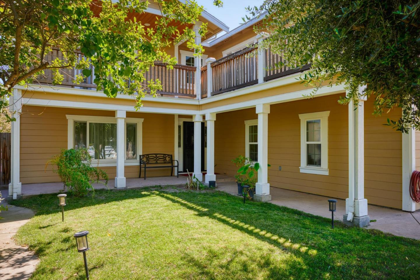 1504 Mable Avenue Modesto, CA 95355 - Photo 3 of 47 front view of a house with a yard