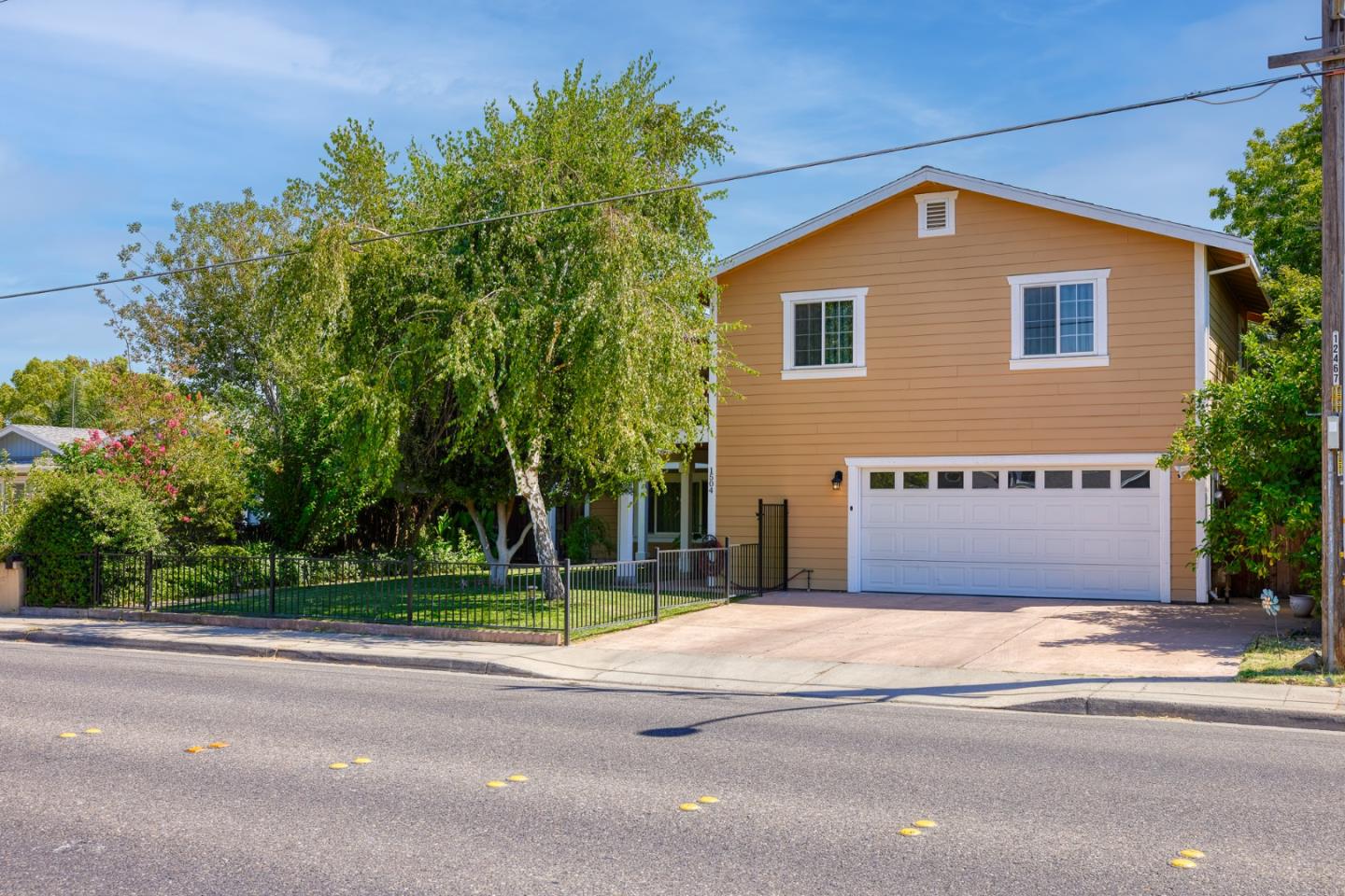 1504 Mable Avenue Modesto, CA 95355 - Photo 4 of 47 a front view of a house with a yard and garage