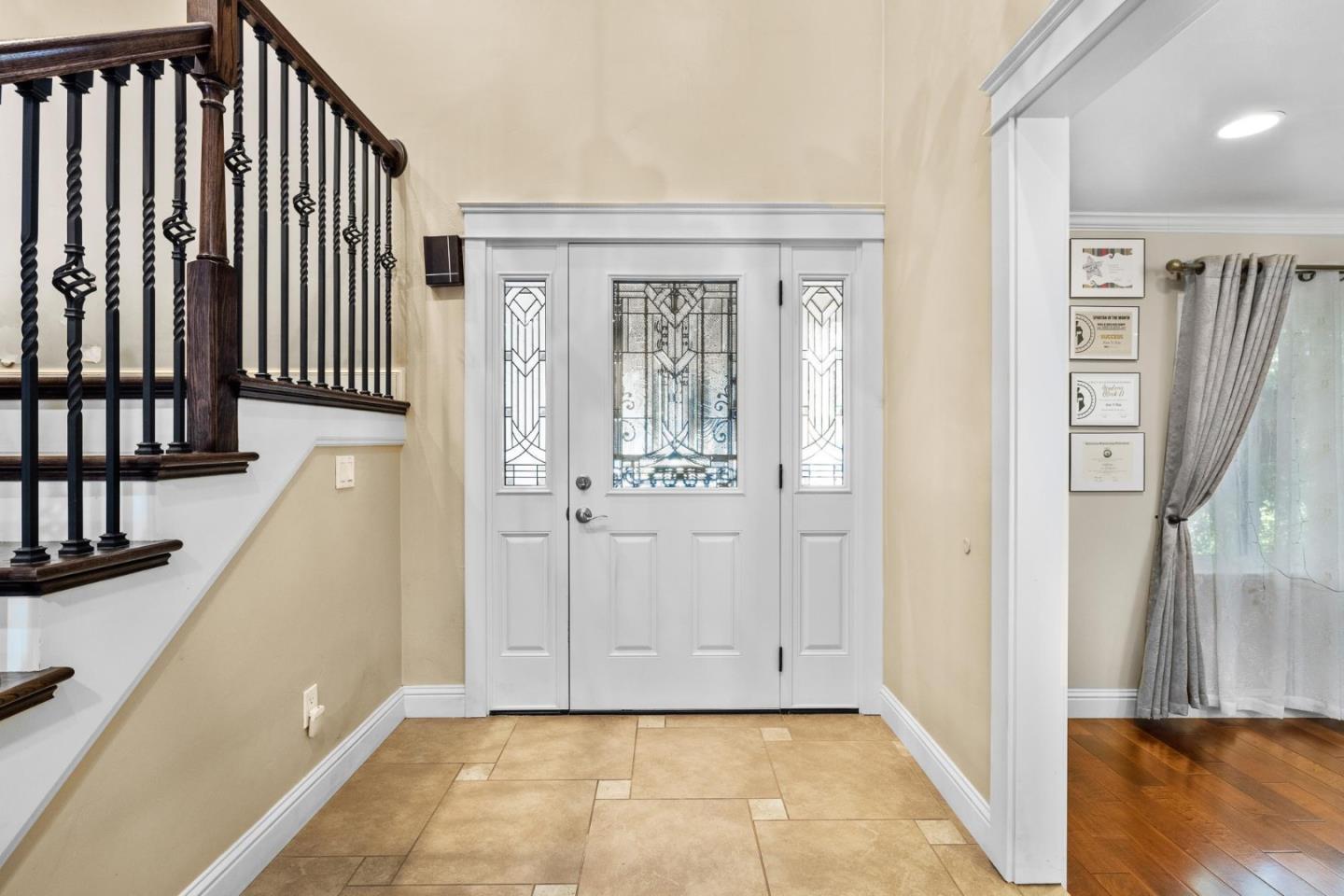 1504 Mable Avenue Modesto, CA 95355 - Photo 5 of 47 a view of a hallway with wooden floor and staircase