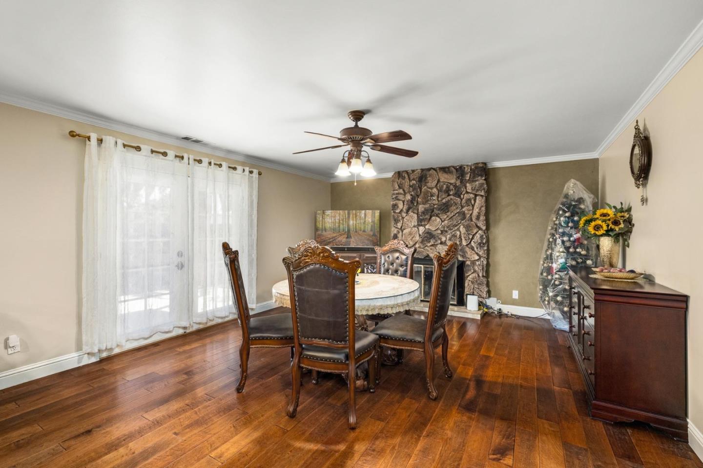 1504 Mable Avenue Modesto, CA 95355 - Photo 9 of 47 a view of a dining room with furniture and wooden floor