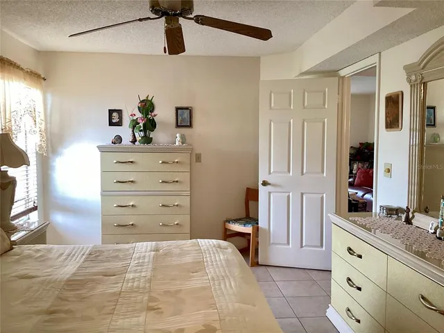 a bed room with a bed and a dresser