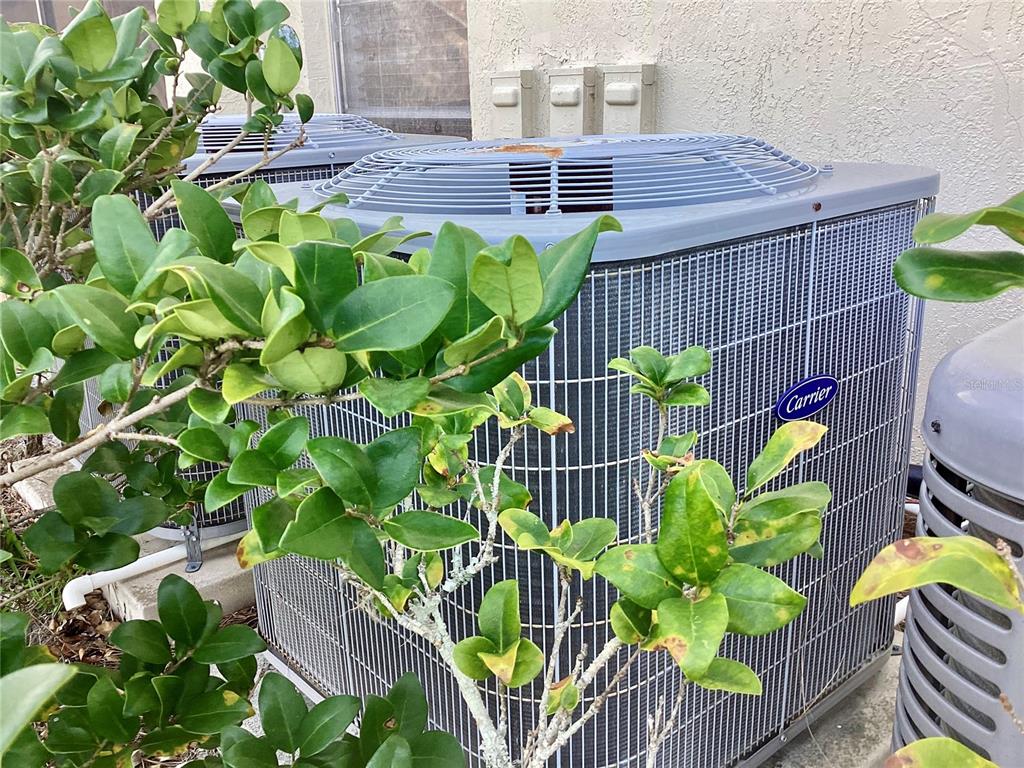 4529 Whitton Way, Unit 214 New Port Richey, FL 34653 - Photo 28 of 45 a view of a chairs and table in a patio