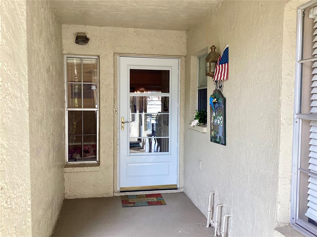 4529 Whitton Way, Unit 214 New Port Richey, FL 34653 - Photo 3 of 45 a view of front door of house