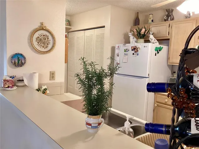 a dining room with furniture and a clock