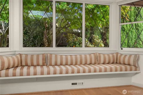 a couch sitting in front of a yard