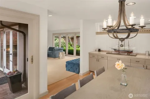 a dining room with table and chairs