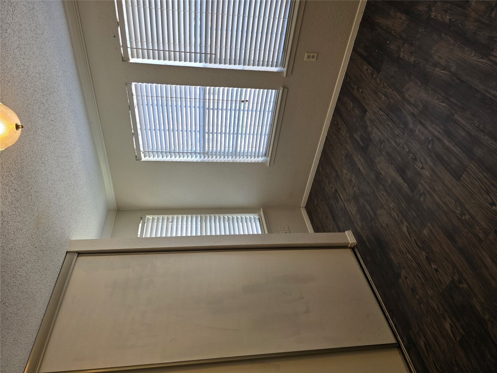 16922 Whitebrush Loop Austin, TX 78717 - Photo 3 of 10 an empty room with wooden floor and windows
