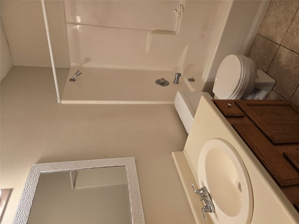 16922 Whitebrush Loop Austin, TX 78717 - Photo 4 of 10 a bathroom with a sink a toilet and shower