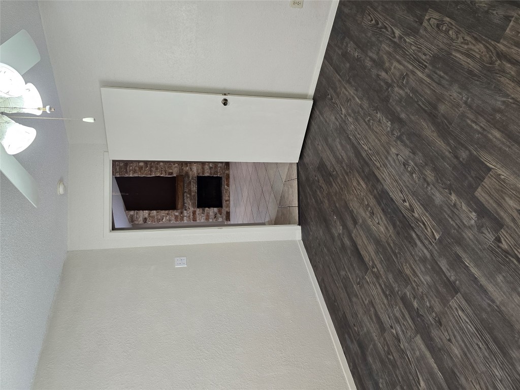 16922 Whitebrush Loop Austin, TX 78717 - Photo 8 of 10 a view of empty room with wooden floor and fan