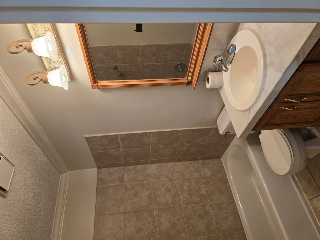 16922 Whitebrush Loop Austin, TX 78717 - Photo 9 of 10 a bathroom with a sink a toilet and shower