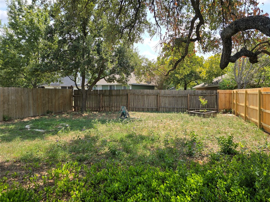 16922 Whitebrush Loop Austin, TX 78717 - Photo 10 of 10 a backyard of a house