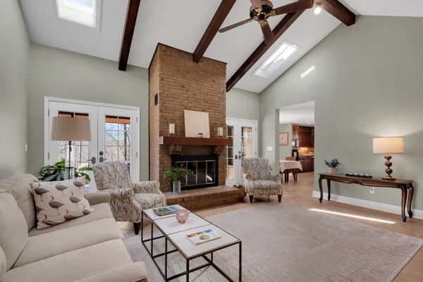 a living room with furniture and a large window