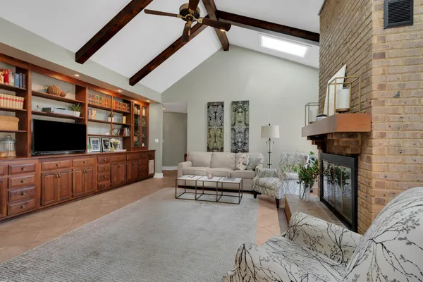 a kitchen with stainless steel appliances granite countertop a stove refrigerator and a wooden cabinets