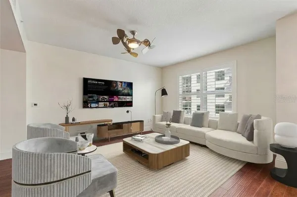 a living room with furniture and a flat screen tv