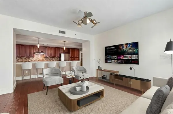 a large kitchen with stainless steel appliances a large counter top and a stove