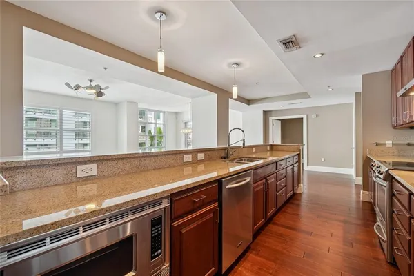 a view of kitchen with wooden floor and window