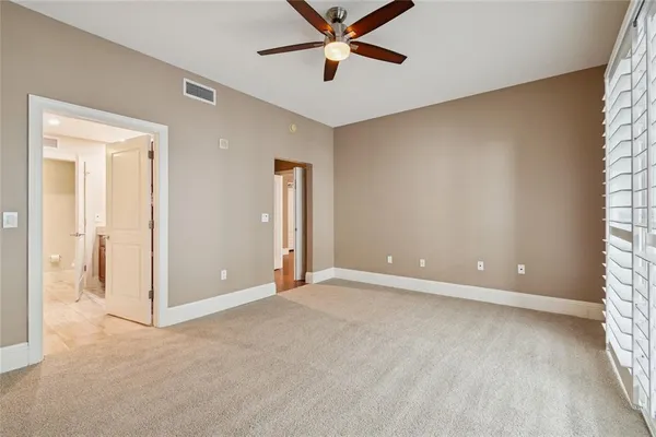 a view of staircase with white walls and a window