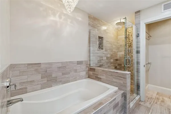 a bathroom with a granite countertop sink mirror and double