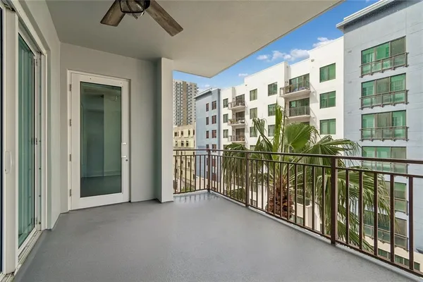 a view of entryway with wooden floor and cabinet