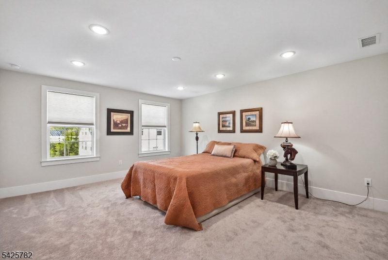723 Station Road Dunellen, NJ 08812 - Photo 13 of 32 a bedroom with a bed and a night stand