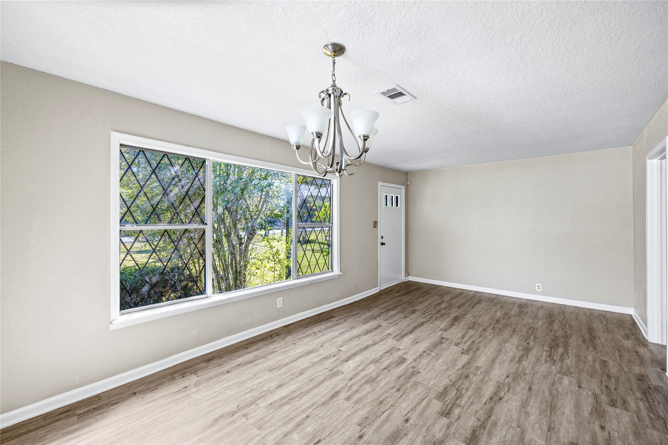 1407 Bess Road Dickinson, TX 77539 - Photo 7 of 32 Living room with large windows.