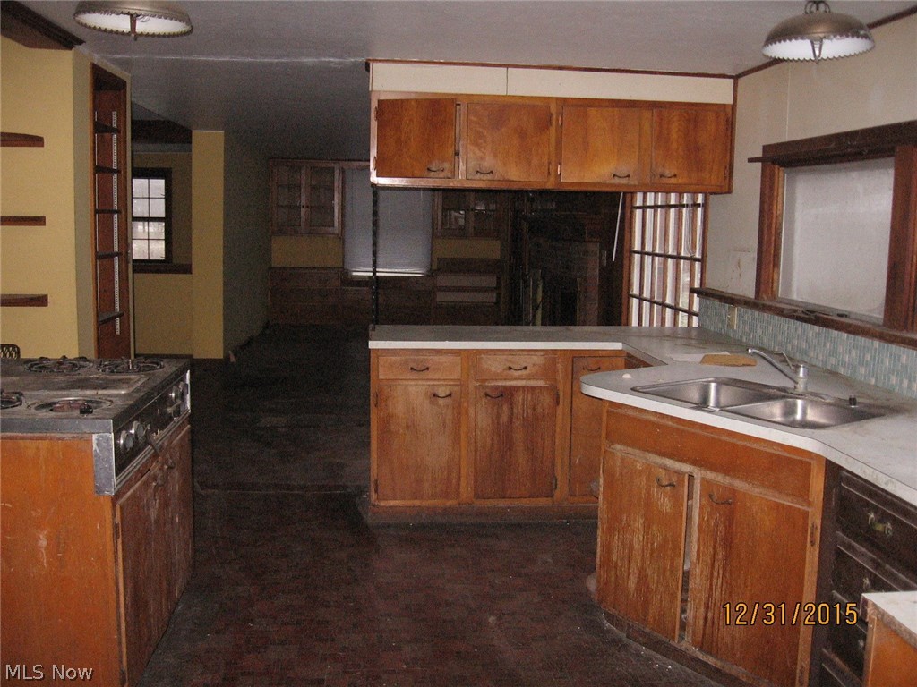 7230 South Ridge Road East Geneva, OH 44041 - Photo 2 of 24 Main house kitchen is open to eat in area with fireplace and built ins.