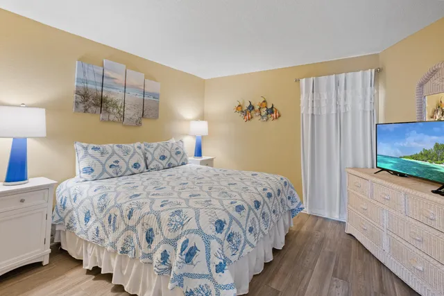 a bathroom with a sink toilet vanity and shower