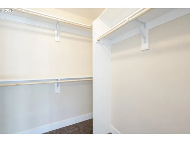 a view of an empty walk in closet