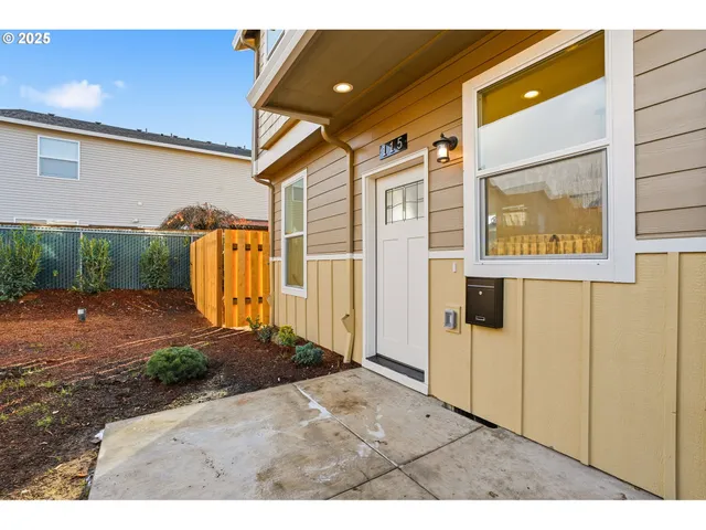 a view of a back yard with an outdoor space