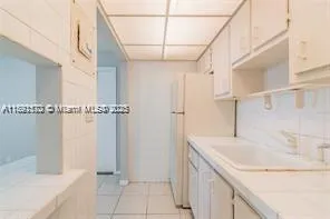a bathroom with a sink and shower
