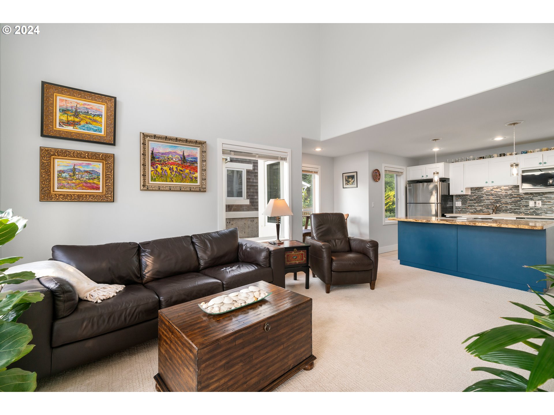 505 Capes Drive, Unit 5 Oceanside, OR 97141 - Photo 12 of 37 a living room with furniture and a view of kitchen