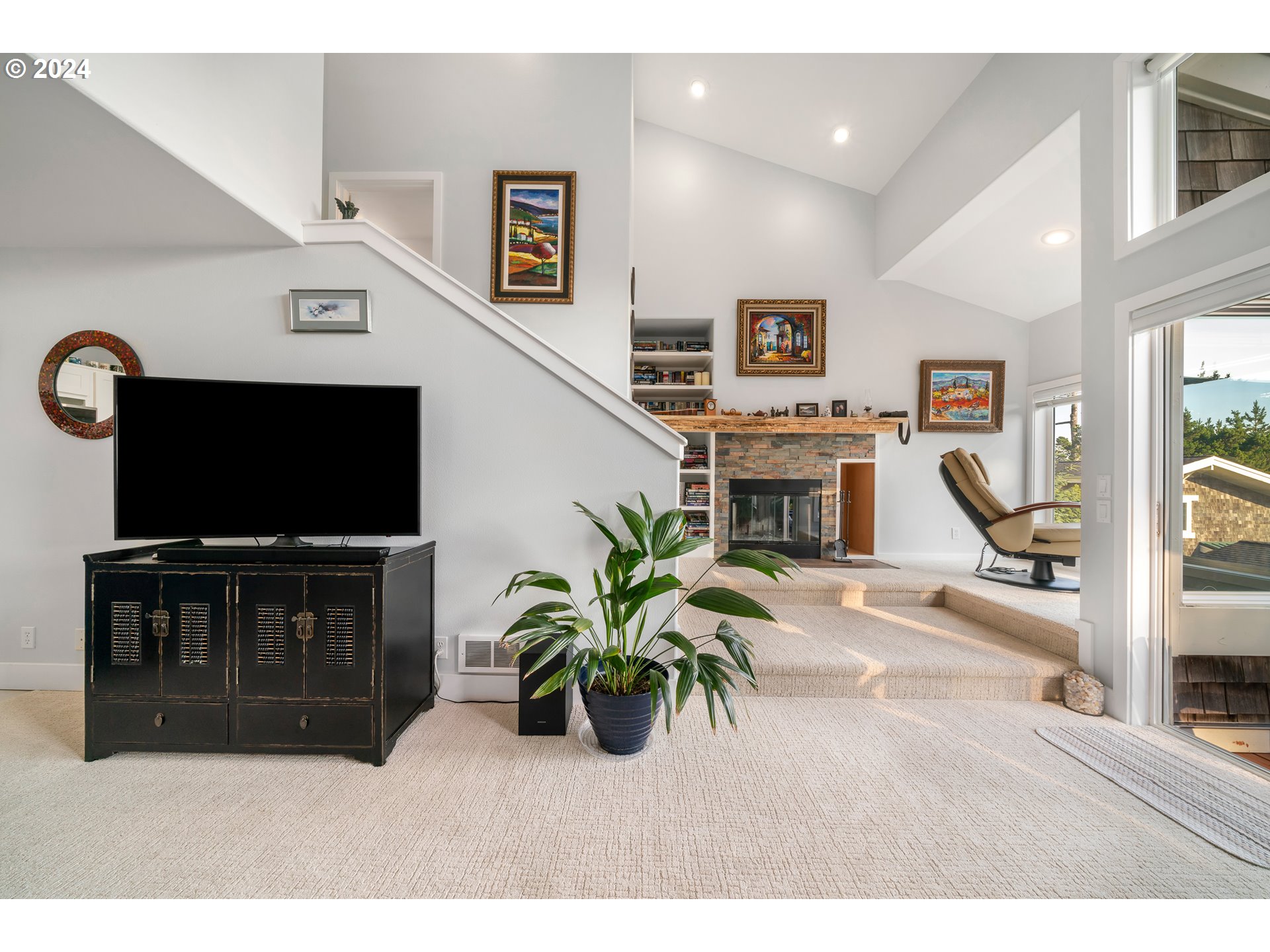 505 Capes Drive, Unit 5 Oceanside, OR 97141 - Photo 17 of 37 a living room with furniture and a flat screen tv