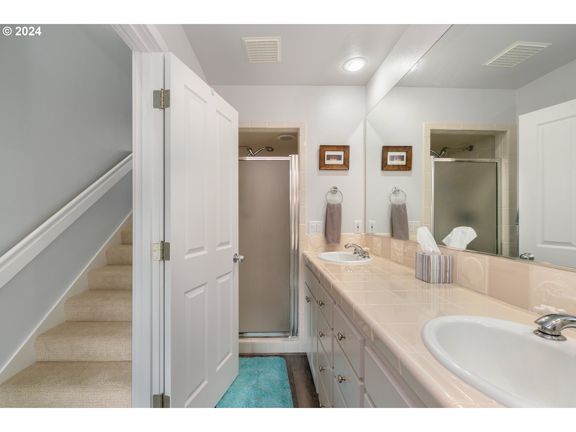 505 Capes Drive, Unit 5 Oceanside, OR 97141 - Photo 20 of 37 a bathroom with a double vanity sink mirror and double