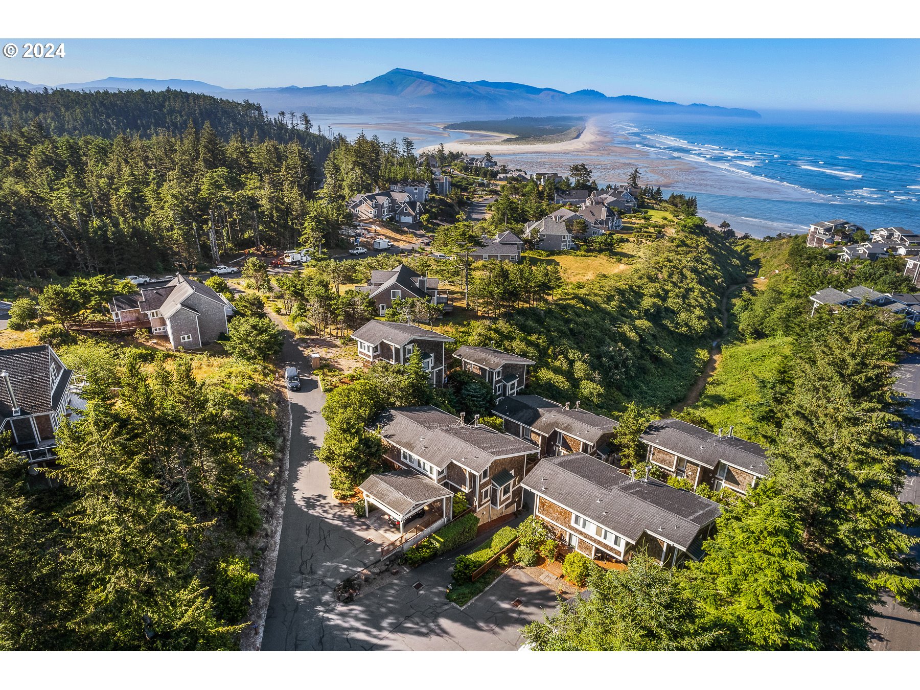 505 Capes Drive, Unit 5 Oceanside, OR 97141 - Photo 2 of 37 a view of a city with sunset view