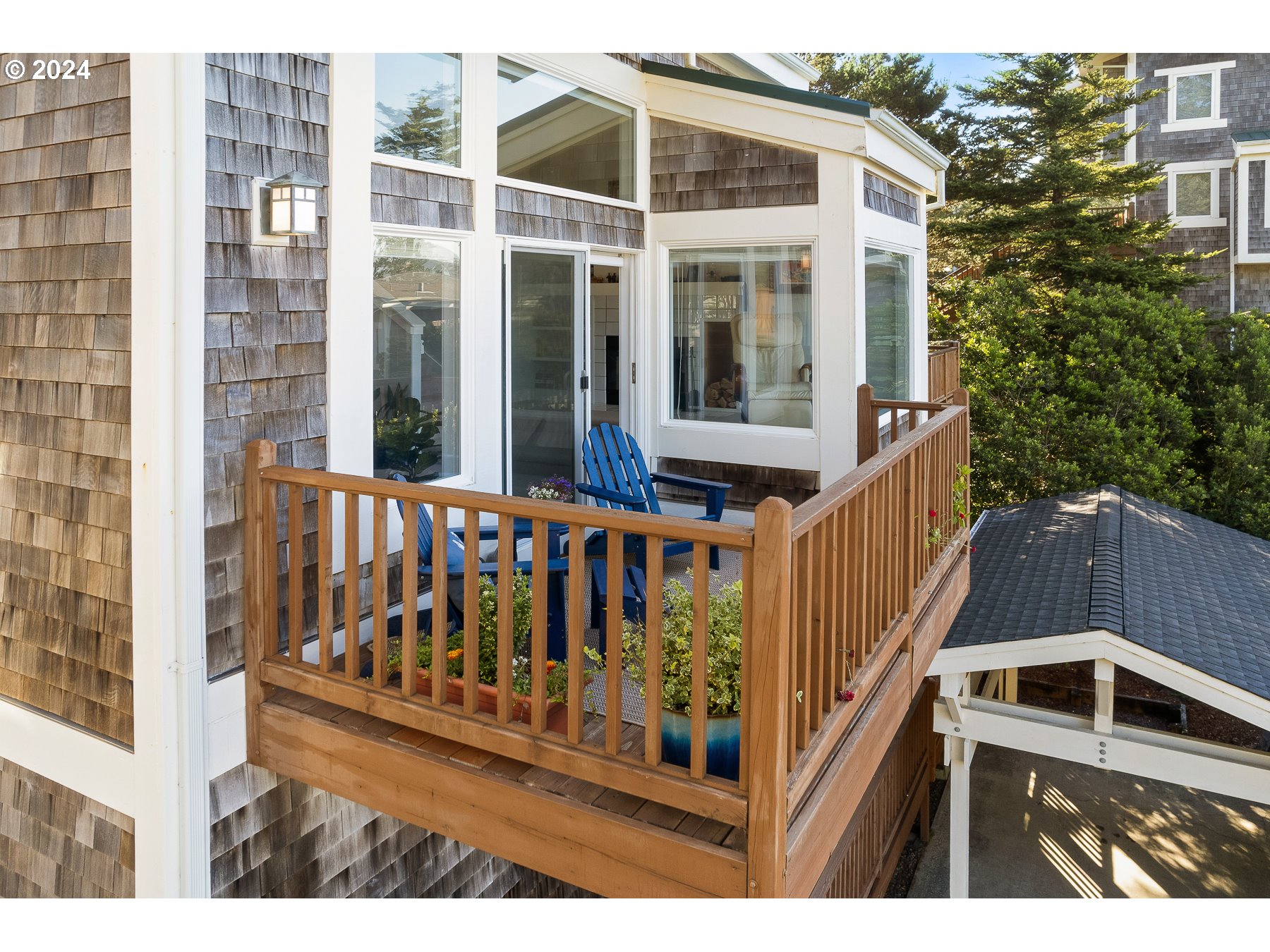 505 Capes Drive, Unit 5 Oceanside, OR 97141 - Photo 28 of 37 a view of a white building from a balcony