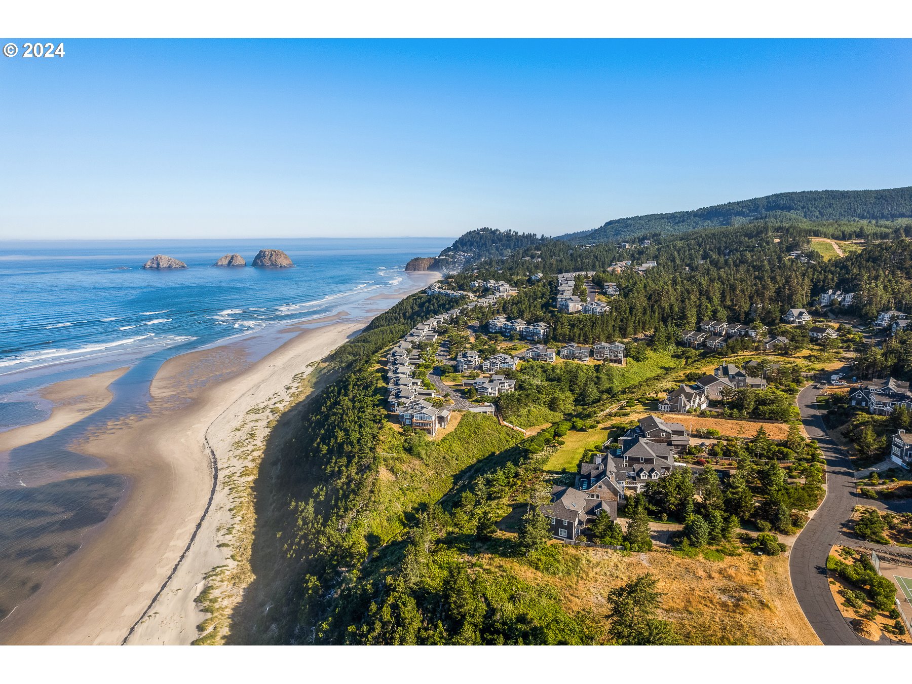 505 Capes Drive, Unit 5 Oceanside, OR 97141 - Photo 31 of 37 a view of an ocean and mountain