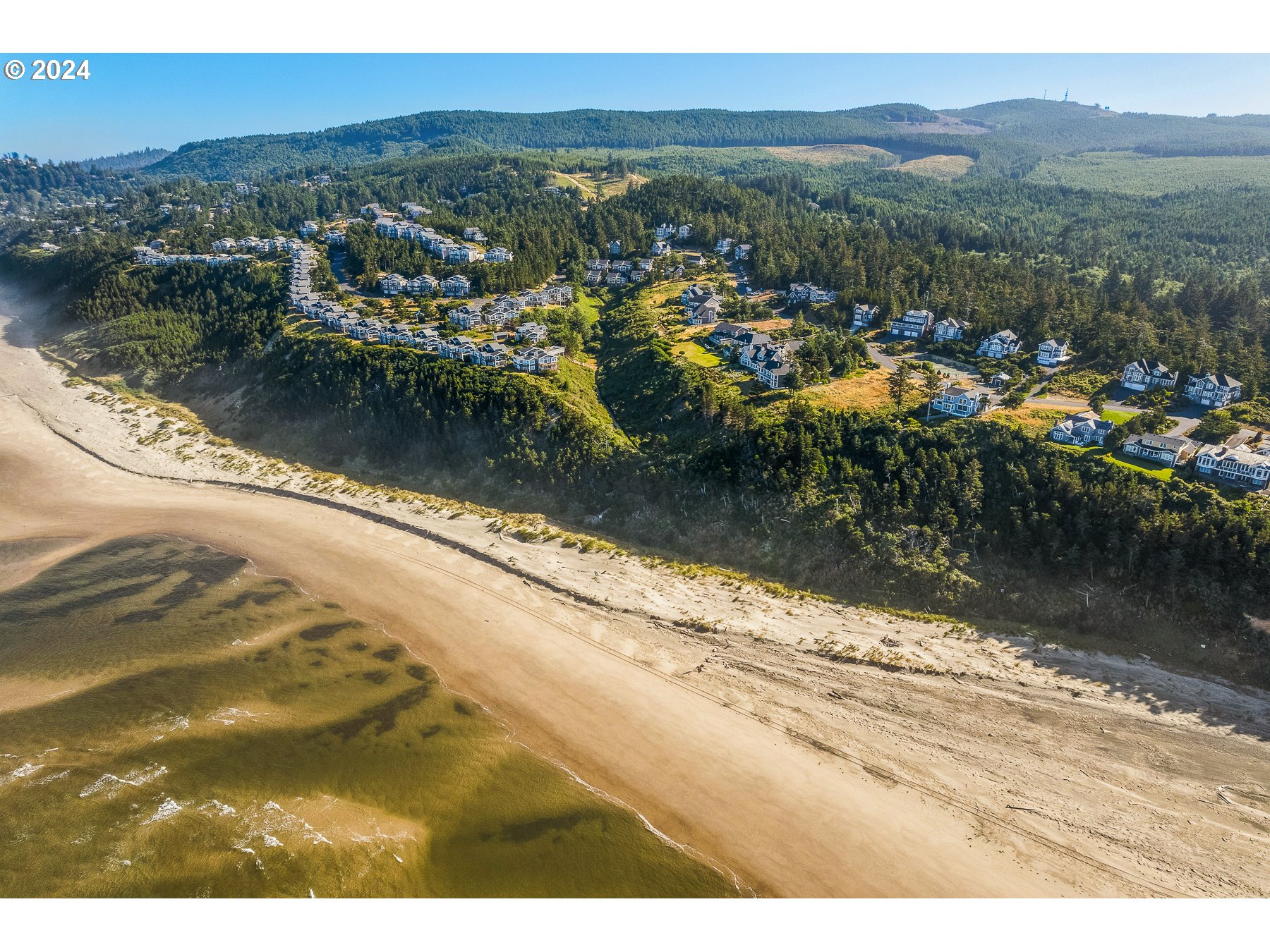 505 Capes Drive, Unit 5 Oceanside, OR 97141 - Photo 33 of 37 a view of a lake with a mountain