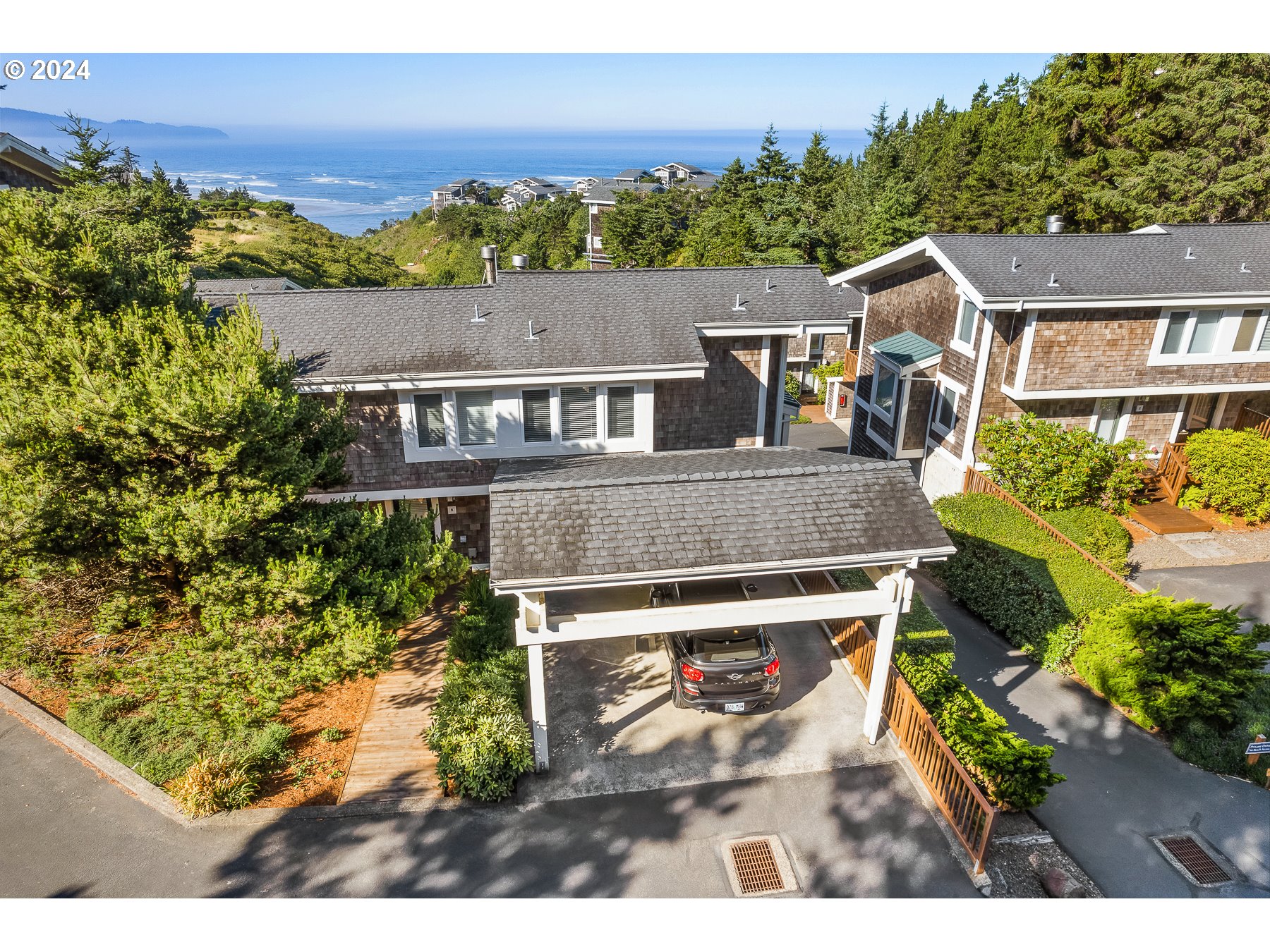 505 Capes Drive, Unit 5 Oceanside, OR 97141 - Photo 4 of 37 an aerial view of residential houses with outdoor space