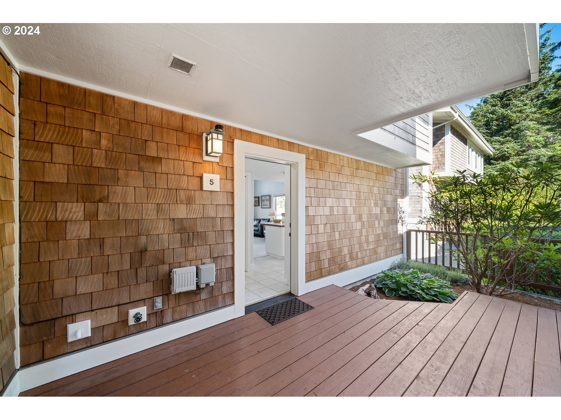 505 Capes Drive, Unit 5 Oceanside, OR 97141 - Photo 5 of 37 a view interior of a house with wooden floor and potted plants