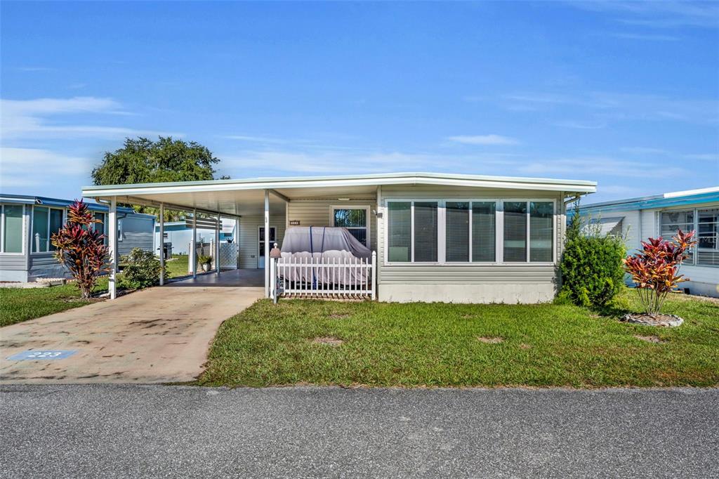 223 Paradise Leesburg, FL 34788 - Photo 1 of 43 a view of house with a big yard plants and large tree